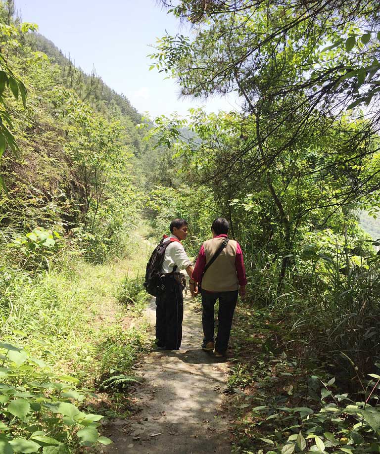   In 2012, Zhang Jiwen and his wife began building roads in